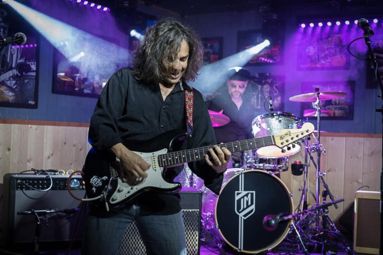 Rocker Kerry Movassagh shreds the night away at Billy Blues Bar &amp; Grill in Hazel Dell, with JM Thunder on drums behind him. Movassagh has been a working musician his entire adult life, he said, until the COVID-19 pandemic stopped live entertainment in bars and restaurants. &quot;I have a rock to sit on, but no cushion,&quot; he said.