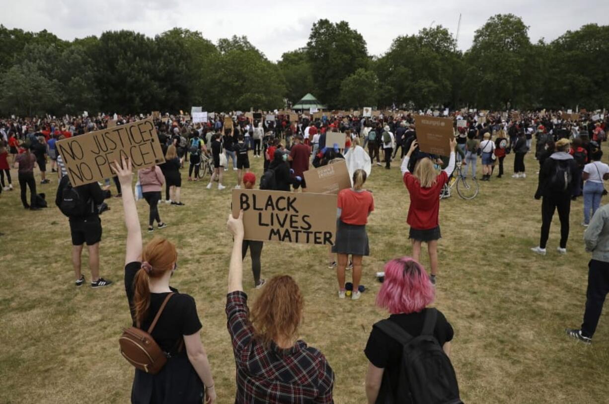 Protesters take part in a demonstration on Wednesday, June 3, 2020, in Hyde Park, London, over the death of George Floyd, a black man who died after being restrained by Minneapolis police officers on May 25. Protests have taken place across America and internationally, after a white Minneapolis police officer pressed his knee against Floyd&#039;s neck while the handcuffed black man called out that he couldn&#039;t breathe. The officer, Derek Chauvin, has been fired and charged with murder.