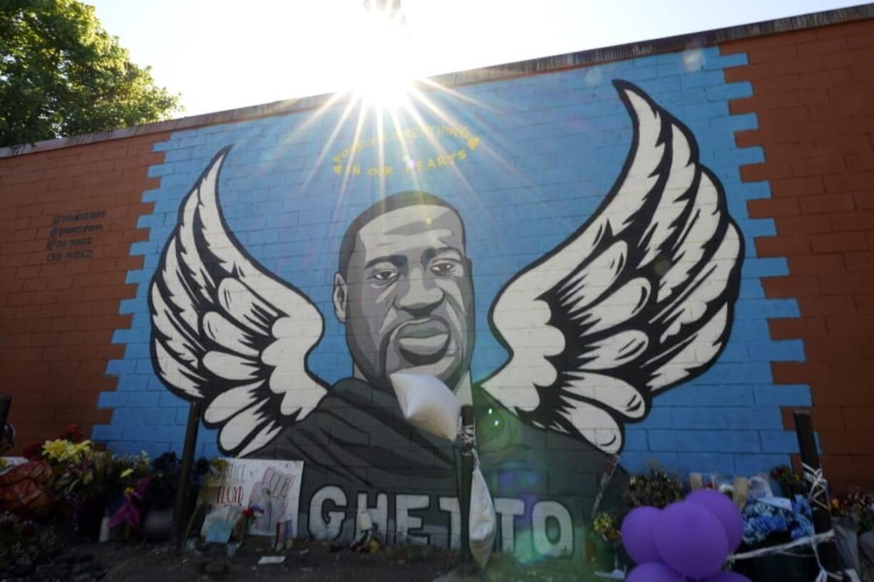 In this Sunday, June 7, 2020, photo, the sun shines above a mural honoring George Floyd in Houston&#039;s Third Ward. Floyd, who grew up in the Third Ward, died after being restrained by Minneapolis police officers on Memorial Day. (AP Photo/David J.