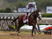 Tiz the Law (8), with jockey Manny Franco up, crosses the finish line to win the152nd running of the Belmont Stakes horse race, Saturday, June 20, 2020, in Elmont, N.Y.