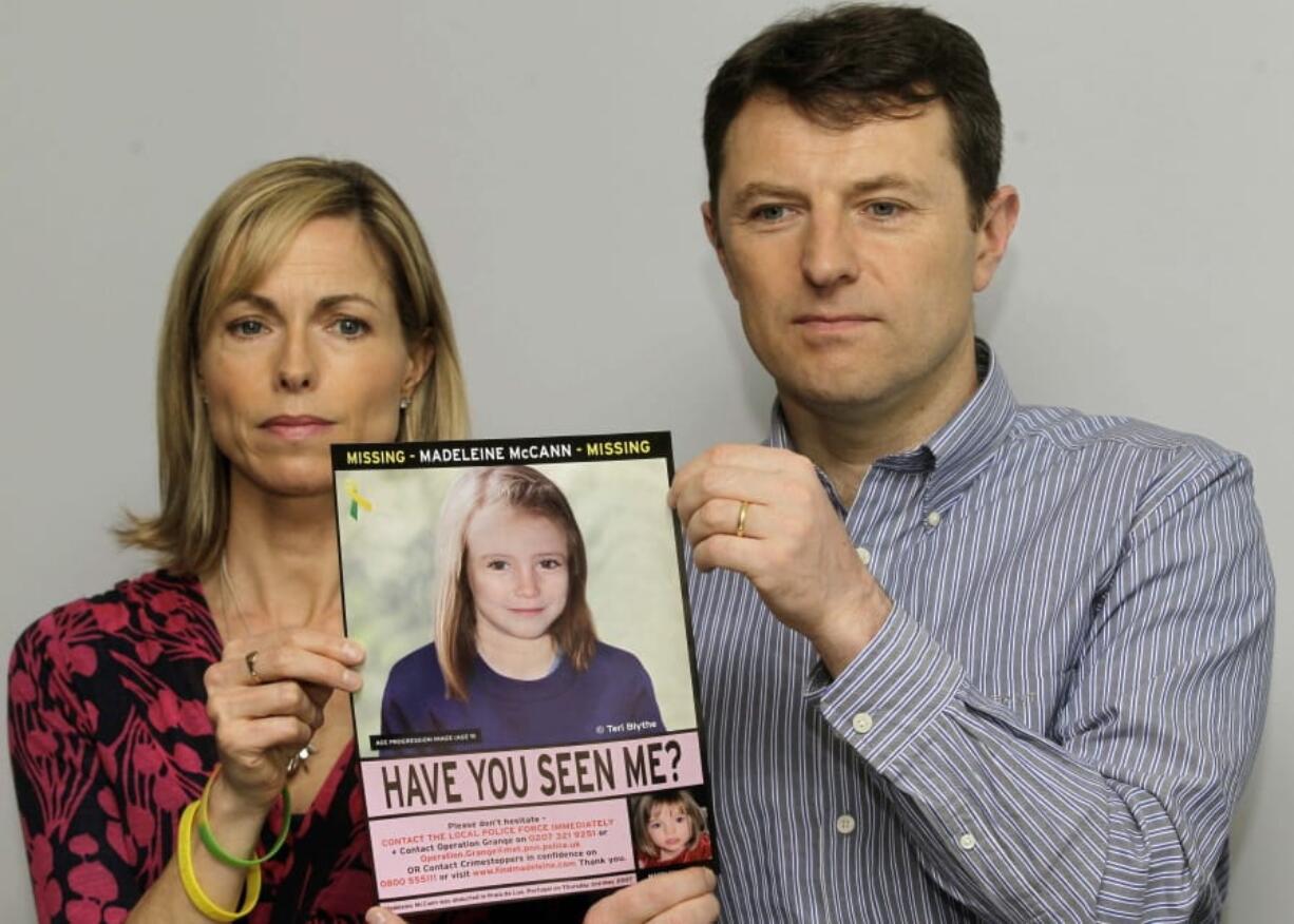 FILE - In this May 2, 2012 file photo, Kate and Gerry McCann pose for the media with a missing poster depicting an age progression computer generated image of their daughter Madeleine at nine years of age, to mark her birthday and the 5th anniversary of her disappearance during a family vacation in southern Portugal in May 2007, during a news conference in London. Madeleine McCann&#039;s family is hoping for closure in the case after a key suspect was identified in Germany and as authorities there say they believe the missing British girl is dead.