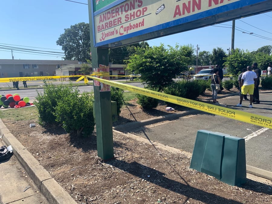 Police tape is seen near the scene of a shooting early Monday, June 22, 2020 in Charlotte, North Carolina, that resulted in two deaths and several more people wounded or injured. Police say a shooting in North Carolina&#039;s largest city has left two people dead and multiple others wounded, while several others were hit by vehicles at the scene.