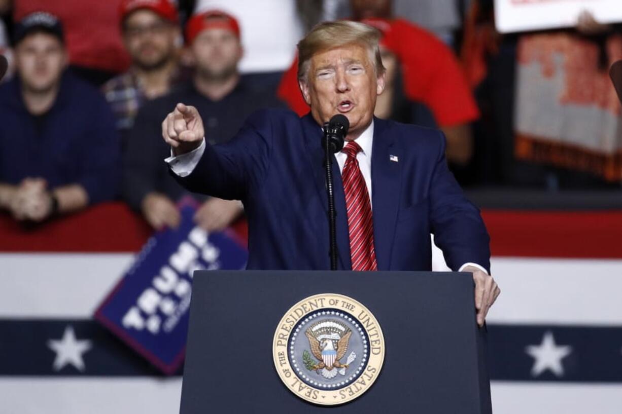 FILE - In this Friday, Feb. 28, 2020, file photo, President Donald Trump speaks during a campaign rally, in North Charleston, S.C. Trump is looking to reverse a decline in his political fortunes by returning to the format that has so often energized himself and his base: a raucous, no-holds-barred rally before thousands of ardent supporters. Trump understands the stakes and is pushing ahead despite pleas from some health officials in Oklahoma to delay a rally in Tulsa on Saturday, June 20 until the region has a better handle on the coronavirus.