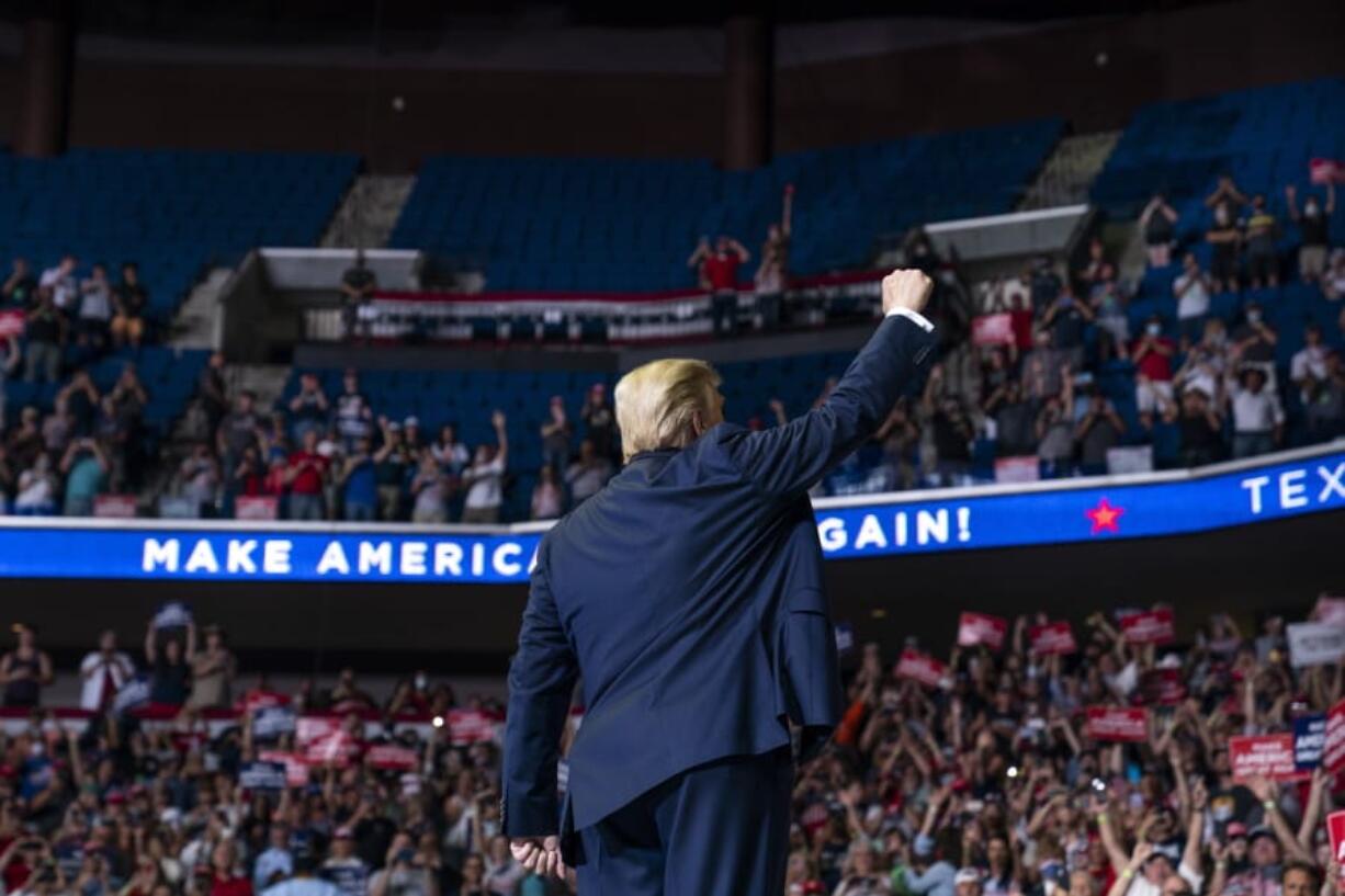 President Donald Trump arrives on stage to speak at a campaign rally at the BOK Center, Saturday, June 20, 2020, in Tulsa, Okla.