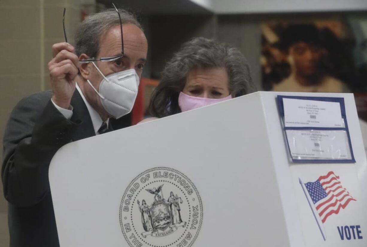 Pat Ennis Engel, right, stands with her husband Congressman Eliot Engel as he prepares to cast votes for primary elections Tuesday June 23, 2020, in the Riverdale section of New York. Engel is being challenged by former middle school principal Jamaal Bowman.