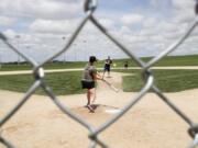 Visitors play on the field at the Field of Dreams movie site, Friday, June 5, 2020, in Dyersville, Iowa. Major League Baseball is building another field a few hundred yards down a corn-lined path from the famous movie site in eastern Iowa but unlike the original, it&#039;s unclear whether teams will show up for a game this time as the league and its players struggle to agree on plans for a coronavirus-shortened season.