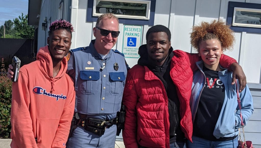 From left, Izac Robinson, Woodland Mayor and Washington Patrol Trooper Will Finn, Nehemiah Polk-Rasheed and Aaliyah Guard. The group, minus Finn, and their friend Sameayah Pehlke were chased by a white man with a gun from a beach in Kalama on Wednesday. Cowlitz County sheriff’s deputies have arrested Dean A. Schrader, 76, of Kalama in relation to the incident. Finn was not involved in investigating the incident in Kalama.