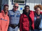 From left, Izac Robinson, Woodland Mayor and Washington Patrol Trooper Will Finn, Nehemiah Polk-Rasheed and Aaliyah Guard. The group, minus Finn, and their friend Sameayah Pehlke were chased by a white man with a gun from a beach in Kalama on Wednesday. Cowlitz County sheriff’s deputies have arrested Dean A. Schrader, 76, of Kalama in relation to the incident. Finn was not involved in investigating the incident in Kalama.