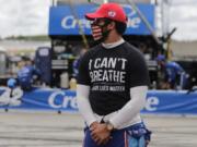 Bubba Wallace (43) wears a &quot;I Can&#039;t Breath, Black Lives Matter&quot; shirt before a NASCAR Cup Series auto race at Atlanta Motor Speedway, Sunday, June 7, 2020, in Hampton, Ga.