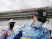 Kyle Busch, left, and Clint Bowyer, right, laugh on pit row before a NASCAR Cup Series auto race at Atlanta Motor Speedway on Sunday, June 7, 2020, in Hampton, Ga.