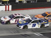 Denny Hamlin (11) drives followed by Chase Elliott (9) and Joey Logano (22) during a NASCAR Cup Series auto race at Bristol Motor Speedway Sunday, May 31, 2020, in Bristol, Tenn.