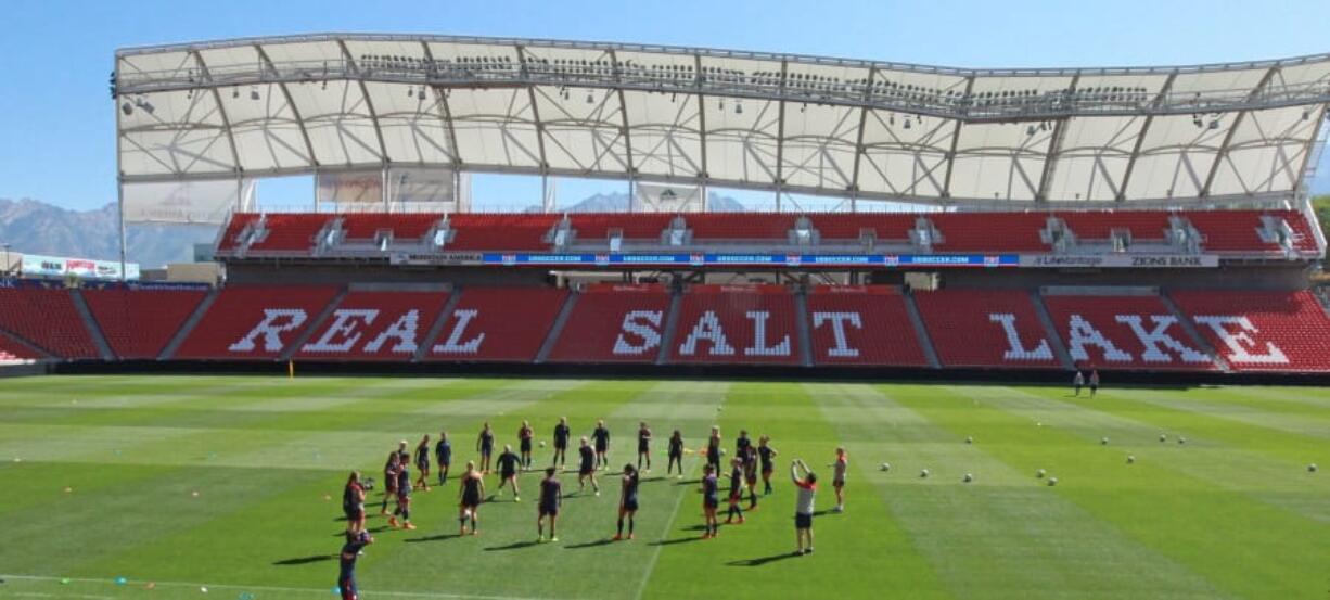 FILE - In this Sept. 12, 2014 file photo, members of the U.S. Women&#039;s National team warm up during practice at Rio Tinto Stadium in Sandy, Utah. Pro soccer returns to the U.S. next month when the National Women&#039;s Soccer League starts a 25-game tournament in a pair of stadiums in Utah that will be kept clear of fans to protect players from the coronavirus. Players from the nine teams will train and live at two Salt Lake City-area hotels, the league announced Wednesday, May 27, 2020.