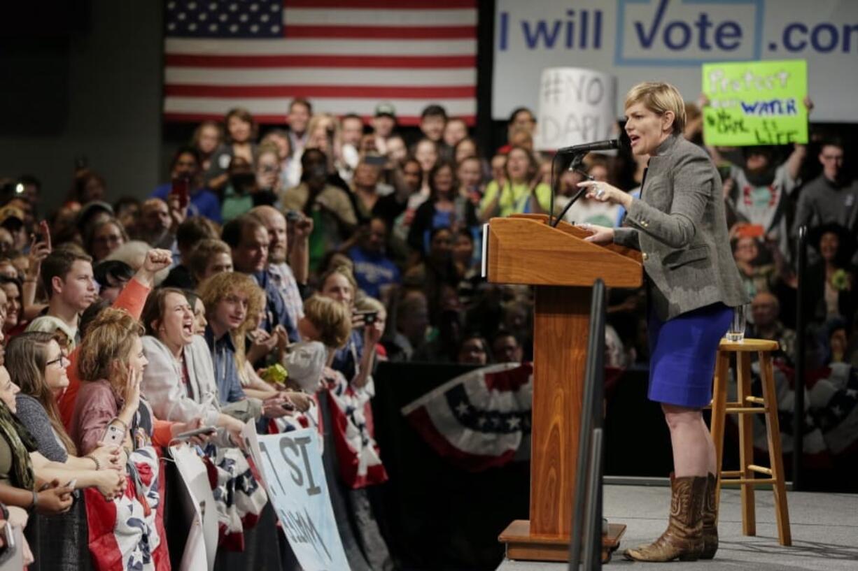 In this Nov. 4, 2016, photo, Nebraska Democratic Party chairwoman Jane Kleeb is about to introduce Sen. Bernie Sanders, I-Vt., during a rally for Democratic presidential candidate Hillary Clinton, in Omaha, Neb. Kleeb published a book in 2020 about how her party could return from relative irrelevance in rural America and once again win elections, but the last few months have shown just how difficult that task can be.