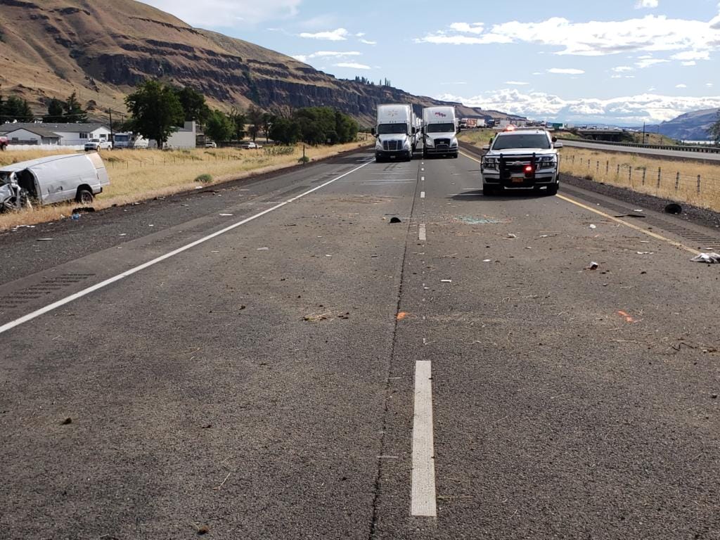 A Washougal woman was killed and a Camas man seriously injured Tuesday when their van went off Interstate 84 in the Columbia River Gorge and overturned.