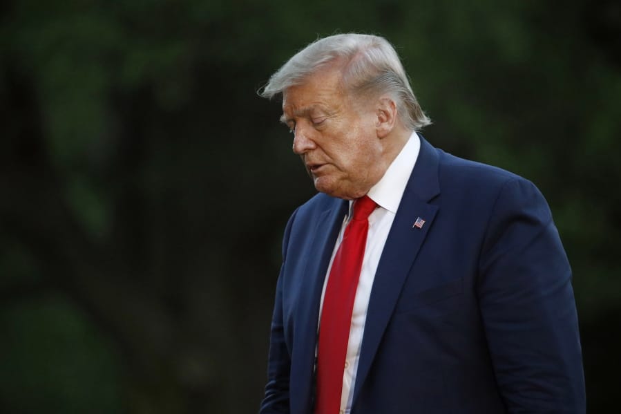 President Donald Trump walks across the South Lawn of the White House in Washington, Saturday, May 30, 2020, after stepping off Marine One as he returns from Kennedy Space Center for the SpaceX Falcon 9 launch.