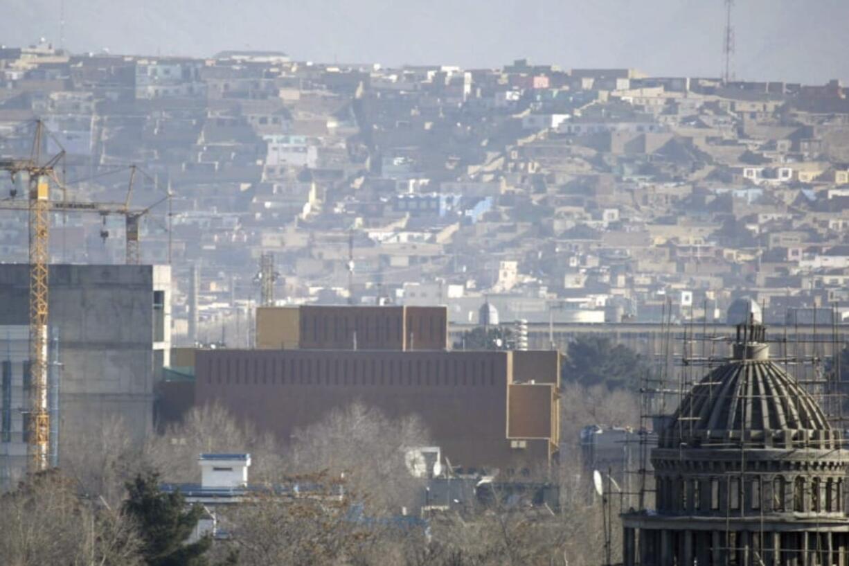 FILE - This Dec. 25, 2013, filer, photo shows a general view of the U.S. Embassy in Kabul, Afghanistan after it was hit by rocket fire in Kabul, Afghanistan. The U.S. State Department says Saturday, June 20, 2020 that COVID-19 infections have been reported at its embassy in the Afghan capital and the staff who are affected include diplomats, contractors and locally employed staff.