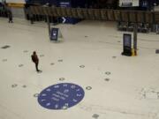 Social distancing guidelines on the floor by train departure information screens to help stop the spread of coronavirus in Waterloo station, London, Thursday, June 4, 2020. Waterloo station, which is wide recognised as the busiest train station in Britain, is still much quieter than normal as most commuters are working from home and not commuting into central London offices.