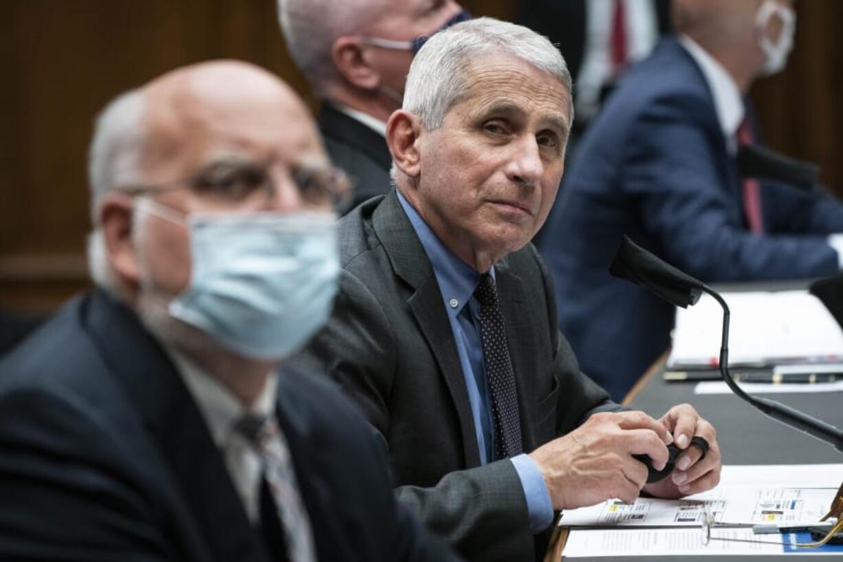 Dr. Robert Redfield, director of the Centers for Disease Control and Prevention, left, Director of the National Institute of Allergy and Infectious Diseases Dr. Anthony Fauci, second from left, listen during a House Committee on Energy and Commerce on the Trump administration&#039;s response to the COVID-19 pandemic on Capitol Hill in Washington on Tuesday, June 23, 2020.