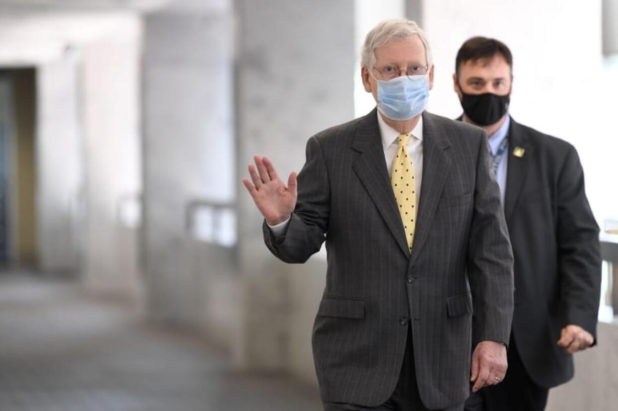 FILE - In this June 4, 2020, file photo Senate Majority Leader Mitch McConnell of Ky., arrives for a Republican luncheon on Capitol Hill in Washington.