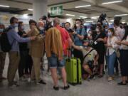 A TUI X3 2312 Duesseldorf-Mallorca flight passenger talks to the press at Son Sant Joan airport in Palma de Mallorca, Spain, Monday, June 15, 2020. Whether its German holidaymakers basking in Spain&#039;s sunshine or Parisians renewing their love affair with their city, Monday&#039;s border openings and further scrapping of restrictions offered Europeans a taste of pre-coronavirus life that they may have taken for granted.