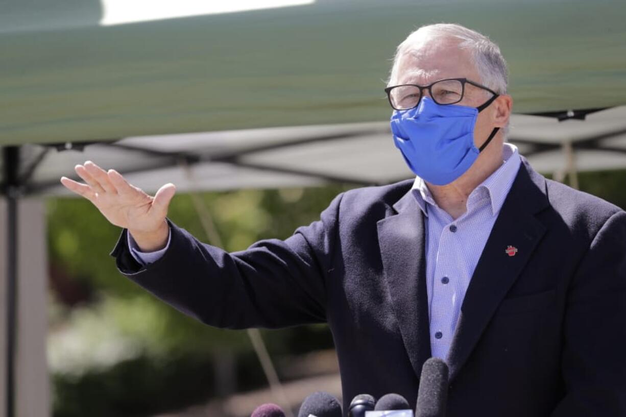 Washington Gov. Jay Inslee motions about the high rate of coronavirus cases in the area during a news conference at Yakima Valley College Tuesday, June 16, 2020, in Yakima, Wash. Inslee met with leaders in local government, health care and business to discuss the impact of the COVID-19 pandemic in the area, which has one of the highest rates of infection in the state.