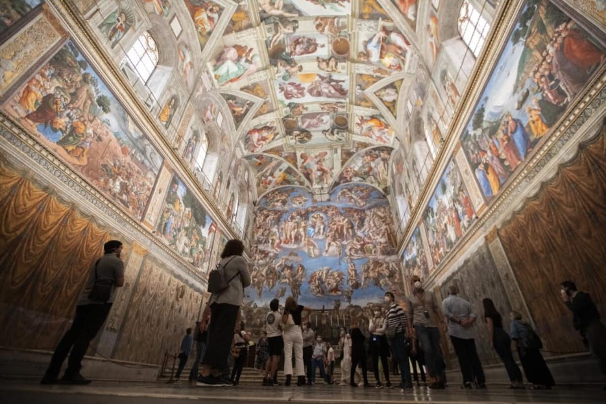 Visitors admire the Sistine Chapel as the Vatican Museum reopened, in Rome, Monday, June 1, 2020. The Vatican Museums reopened Monday to visitors after three months of shutdown following COVID-19 containment measures.