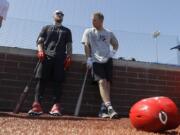 Cincinnati Reds&#039; Tucker Barnhart, left, talks with Josh VanMeter during a workout at Grand Park, Friday, June 12, 2020, in Westfield, Ind. Proceeds from the event will go to Reviving Baseball in the Inner City of Indianapolis.