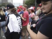 Jacob Osborne and his son Phoenix, enter as safety barricade gates are opened for supporters to enter for  President Donald Trump&#039;s campaign rally on Saturday, June 20, 2020 in Tulsa, Oka.