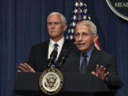 Dr. Anthony Fauci, right, director of the National Institute of Allergy and Infectious Diseases, speaks during a briefing with members of the Coronavirus Task Force, including Vice President Mike Pence, left, at the Department of Health and Human Services in Washington, Friday, June 26, 2020.