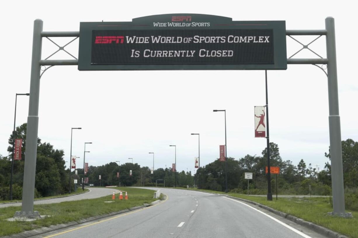 A sign at the entrance to ESPN&#039;s Wide World of Sports at Walt Disney World is seen Wednesday, June 3, 2020, in Kissimmee, Fla. The NBA is set on restarting its season with a 22-team plan at Disney.