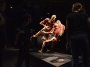 Students walk by the &quot;Football Gladiators&quot; plastinates at the &quot;Body Worlds &amp; The Cycles of Life&quot; exhibit at OMSI in Portland in March, before the museum closed under pandemic shutdown orders. It reopened Saturday.