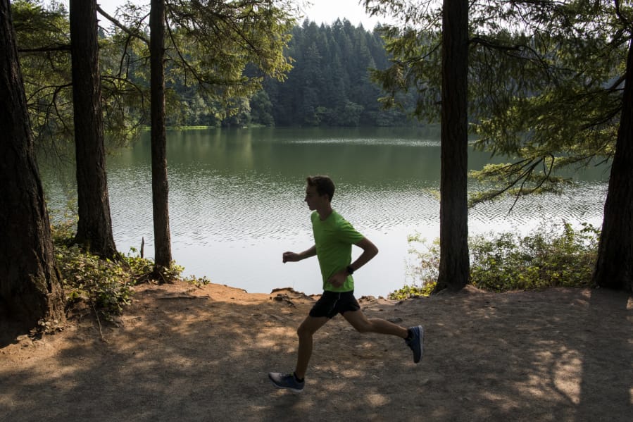 Arunner passes near Round Lake in Camas.