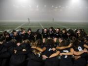 Members of the Union girls team huddle together for a cheer beforeround one of the 4A state soccer playoffs at McKenzie Stadium in Vancouver last season.