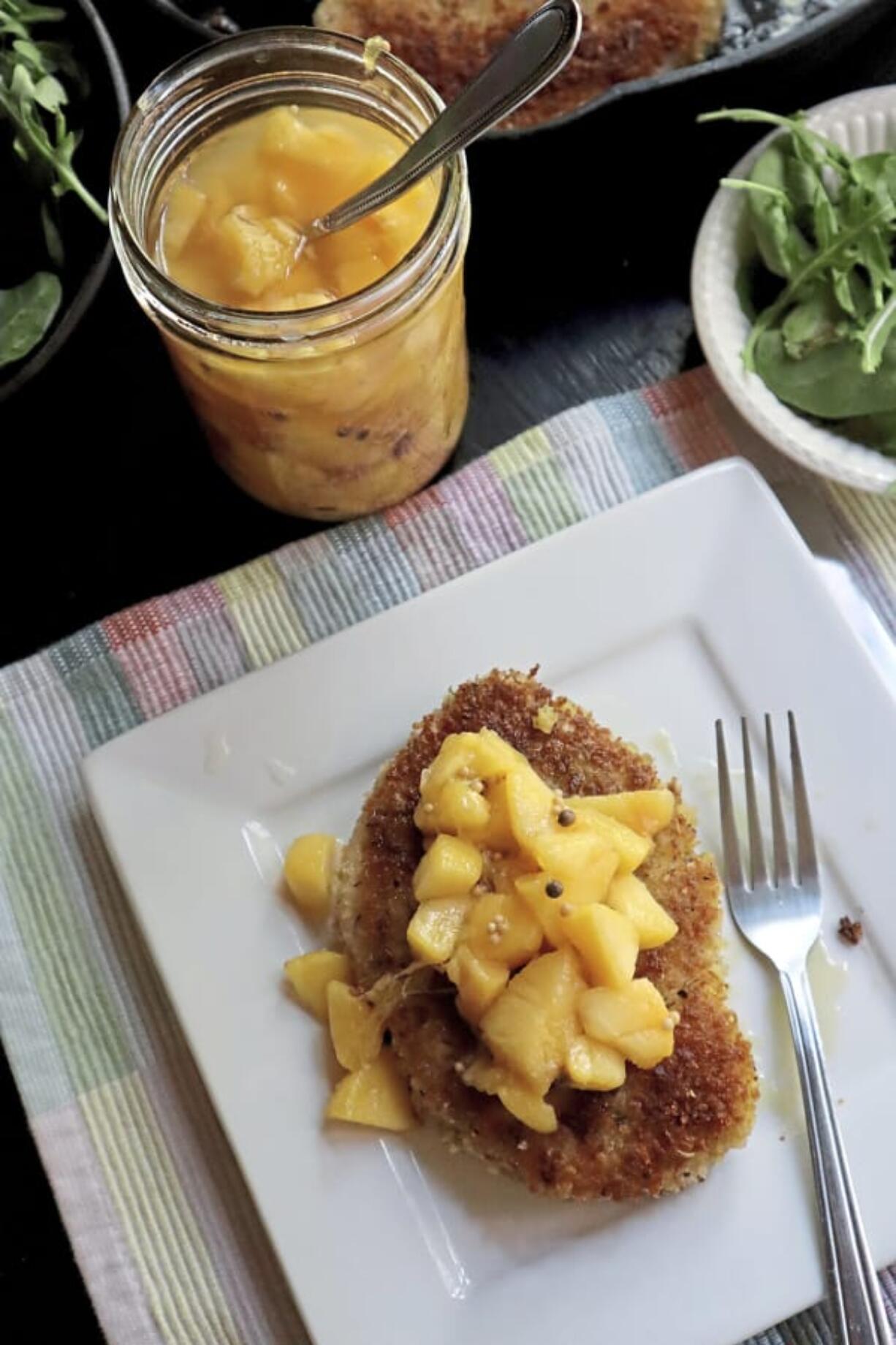 Pickled peaches add a bright, summery note to fried pork chops.