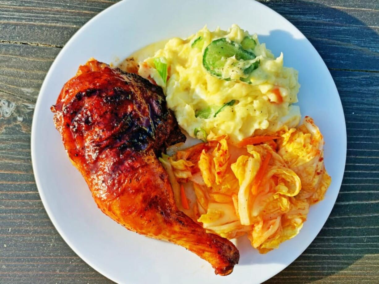 Gochujang-glazed chicken on the grill.&quot; and the other is &quot;Gochujang-glazed grilled chicken with potato salad and kimchi.