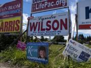 Signs for Clark County Council candidates John Blom and Karen Bowerman are among other campaign signs in east Vancouver on June 23. Blom parted ways with the Republican Party saying the party was moving too far right and its demand for &quot;ideological purity.&quot; The Clark County Republican Party has endorsed Karen Bowerman in the race for the Clark County council, District 3 seat.