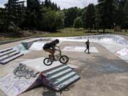 Joseph Moneybrake, left, and Daemion Speckman, both of Portland, bike at Swift Skate Park on Friday. The park reopened on Tuesday. Moneybrake said they noticed many of the skate parks in Portland are still closed, and they wanted to try out a new park.