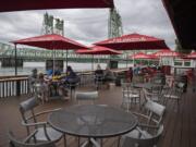 Customers at Who Song &amp; Larry&#039;s practice social distancing while enjoying lunch with a Columbia River view on Tuesday. Owners of the restaurant intend to stay in the location until at least 2041.