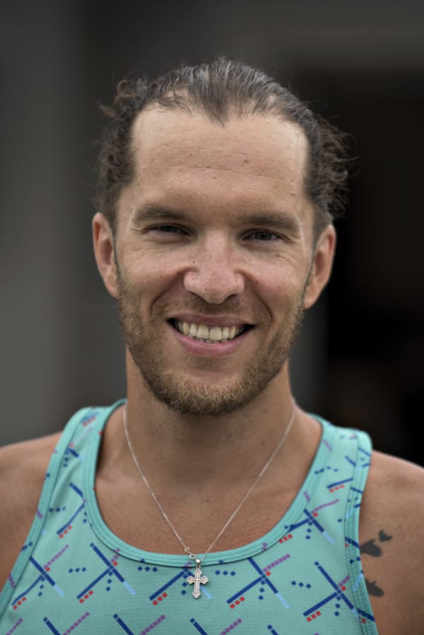 Local triathlete Joshua Monda pauses for a photo outside his Vancouver home Wednesday afternoon, July 22, 2020.