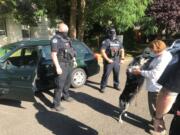 Drew, an Australian shepherd, is reunited with his owner, Gail Krueger, on Friday in Vancouver. Drew was in the backseat of Krueger&#039;s Subaru Legacy when it was stolen two days prior.