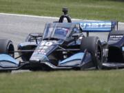 IndyCar driver Felix Rosenqvist (10) corners on Turn 3 during the REV Group Grand Prix auto race Sunday, July 12, 2020, at Road America in Elkhart Lake, Wis. (Gary C.