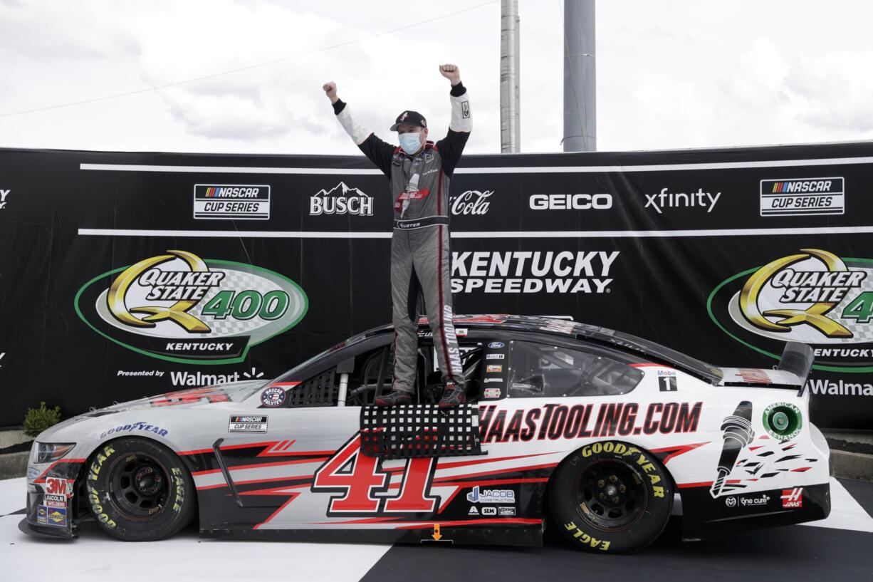 Cole Custer (41) celebrates after winning a NASCAR Cup Series auto race Sunday, July 12, 2020, in Sparta, Ky.