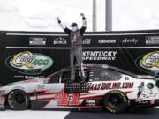 Cole Custer (41) celebrates after winning a NASCAR Cup Series auto race Sunday, July 12, 2020, in Sparta, Ky.