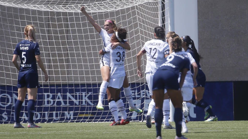 Portland Thorns' Morgan Weaver, rear, celebrates with teammate Simone Charley (38) after scoring against the North Carolina Courage during the second half of an NWSL Challenge Cup soccer match at Zions Bank Stadium Friday, July 17, 2020, in Herriman, Utah.