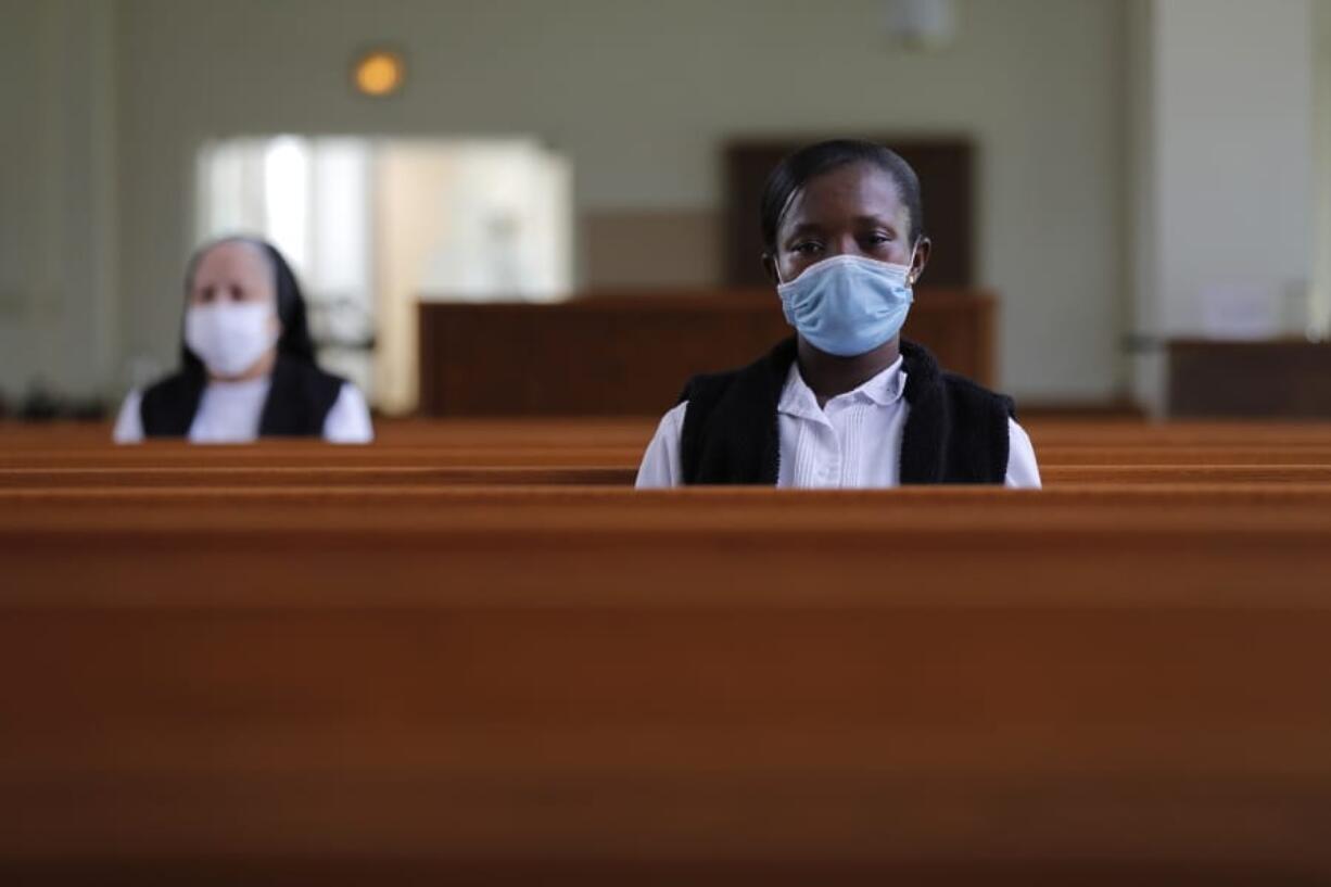 Faustina Bema, a candidate for Novice of the Sisters of the Holy Family, prays inside a chapel during a retreat at its Mother House in New Orleans on July 23.