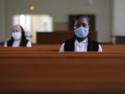 Faustina Bema, a candidate for Novice of the Sisters of the Holy Family, prays inside a chapel during a retreat at its Mother House in New Orleans on July 23.