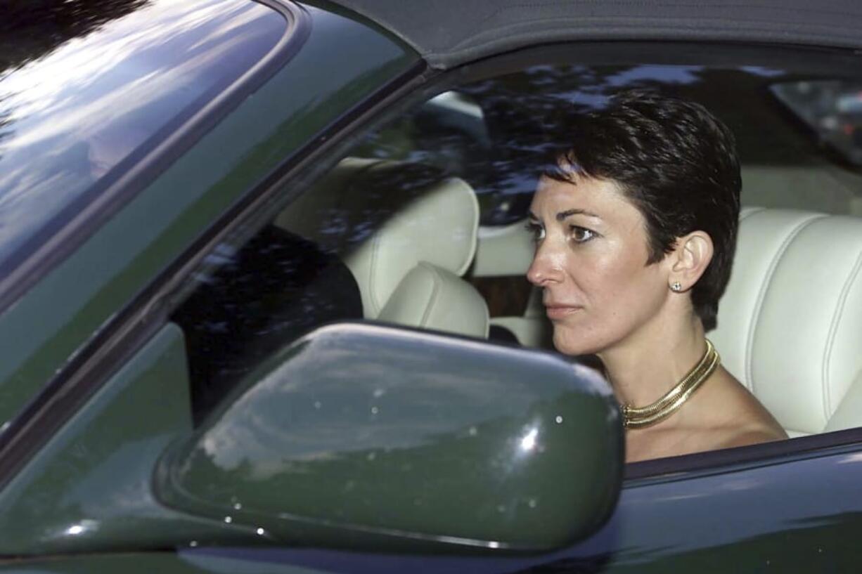 FILE - In this Sept. 2, 2000 file photo, British socialite Ghislaine Maxwell, driven by Britain&#039;s Prince Andrew leaves the wedding of a former girlfriend of the prince, Aurelia Cecil, at the Parish Church of St Michael in Compton Chamberlayne near Salisbury, England. The FBI said Thursday July 2, 2020, Ghislaine Maxwell, who was accused by many women of helping procure underage sex partners for Jeffrey Epstein, has been arrested in New Hampshire.