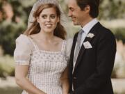 In this photograph released by the Royal Communications of Princess Beatrice and Edoardo Mapelli Mozzi on Sunday, July 19, 2020, Britain&#039;s Princess Beatrice and Edoardo Mapelli Mozzi pose for a photo after their wedding at The Royal Chapel of All Saints at Royal Lodge, Windsor, England. The queen&#039;Aos granddaughter and the property tycoon were married on Friday in the Royal Chapel of All Saints at Royal Lodge, Windsor. The 94-year-old British monarch and her 99-year-old husband Prince Philip attended, along with the parents and siblings of the bride and groom.