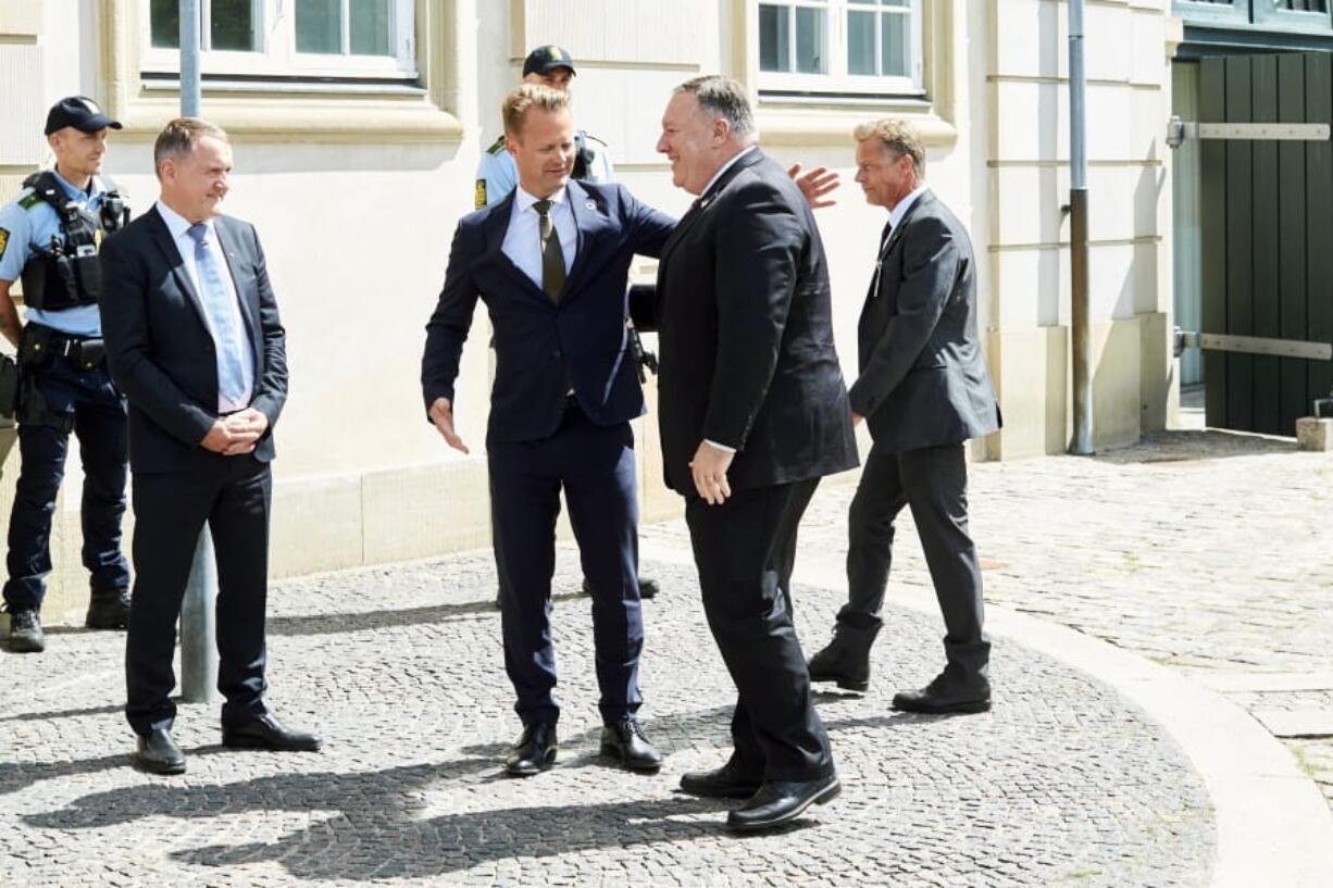 Danish Foreign Minister Jeppe Kofo, centre left, greets US Secretary of State Mike Pompeo, upon his arrival to the Ministry of Foreign Affairs, Eigtveds Pakhus, in Copenhagen, Denmark, Wednesday, July 22, 2020. Pompeo arrived in Denmark on Wednesday for meetings with the country&#039;s leaders that are likely to address the construction of a disputed gas pipeline which Washington opposes.