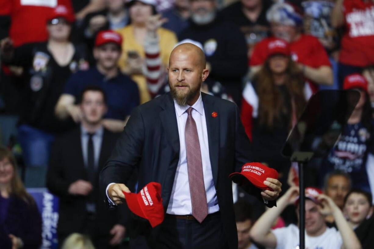 FILE - In this Thursday, March 28, 2019, file photo, Brad Parscale, manager of President Donald Trump&#039;s reelection campaign, throws &quot;Make America Great Again,&quot; hats to the audience before a rally in Grand Rapids, Mich. Trump is shaking up his campaign amid sinking poll numbers, replacing Parscale with veteran GOP operative Bill Stepien. Trump and Parscale&#039;s relationship had been strained since a Tulsa, Okla., rally that drew a dismal crowd, infuriating the president.